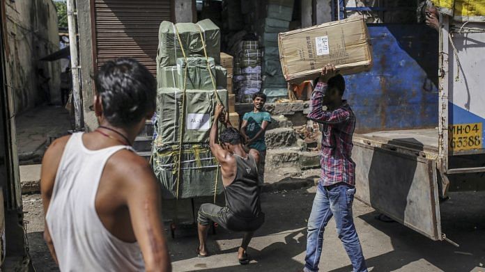 A labourer at work in Mumbai | File Photo: Dhiraj Singh | Bloomberg