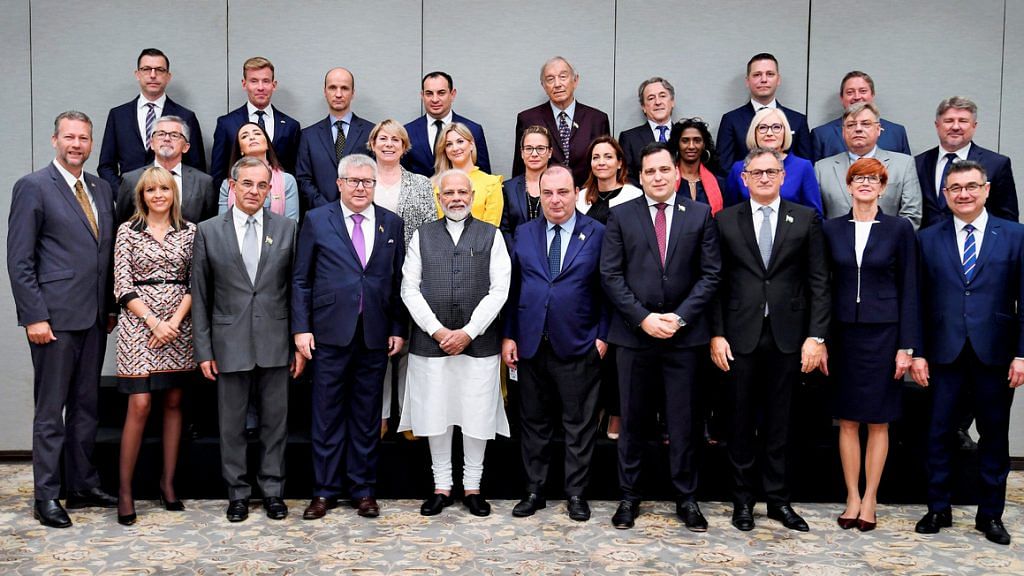 Prime Minister Narendra Modi poses for a photograph with the members of European Parliament | PTI