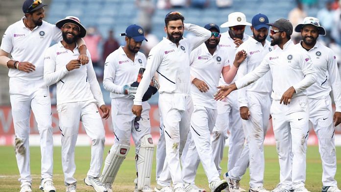 Indian cricket team players celebrate their victory during the day 4 of second India-South Africa cricket test match in Pune, on 13 October | Photo: PTI