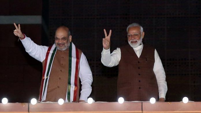Narendra Modi and Amit Shah at the BJP headquarters in New Delhi after Haryana and Maharashtra poll results | Suraj Singh Bisht | ThePrint