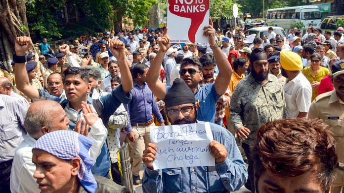 PMC Bank customers stage a protest outside the Killa Court, where the accused of the bank scam were being produced, in Mumbai, Monday, 14 October, 2019. | PTI