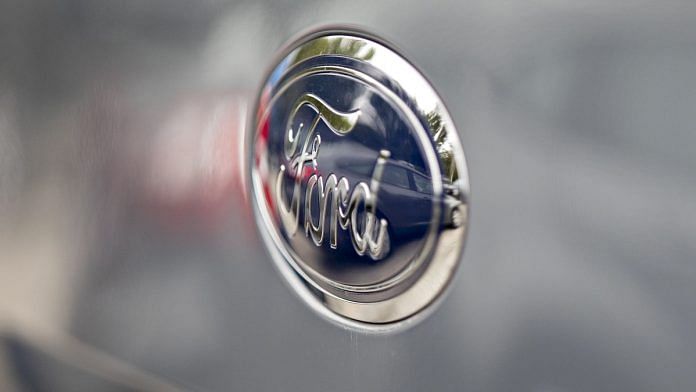 A Ford Motor Co. badge is seen on a vehicle displayed at a car dealership. | Photographer: Daniel Acker | Bloomberg