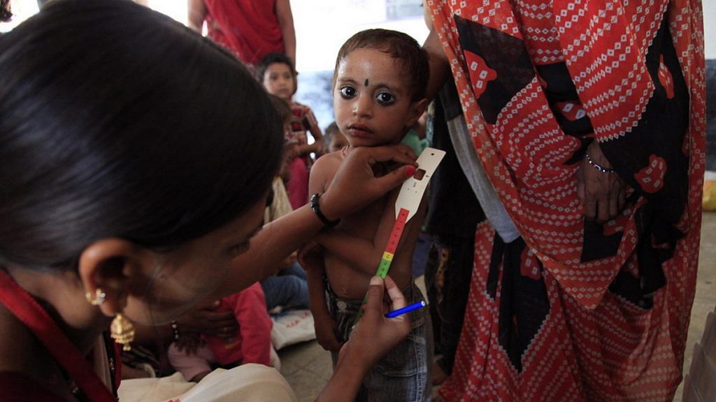 Representational image of an Indian child being measured for malnutrition