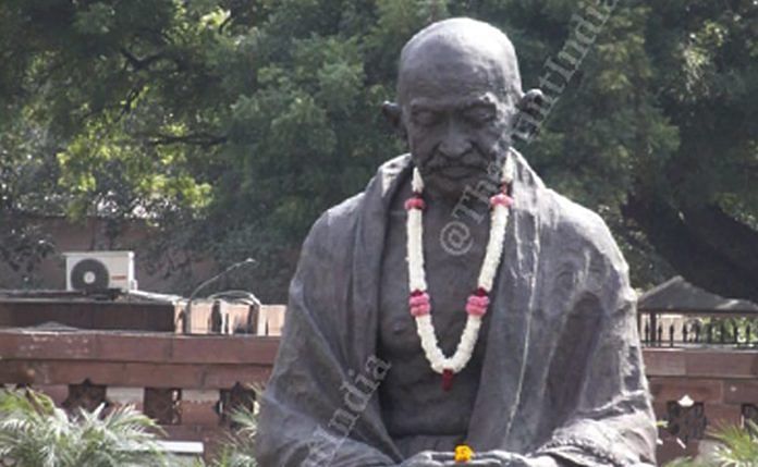 Mahatama Gandhi's statue, at Parliament, adorned with flowers on occasion of his 150th birth anniversary | Praveen Jain | ThePrint