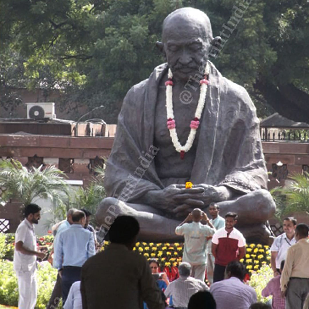 Mahatama Gandhi's statue, at Parliament, adorned with flowers on occasion of his 150th birth anniversary | Praveen Jain | ThePrint 
