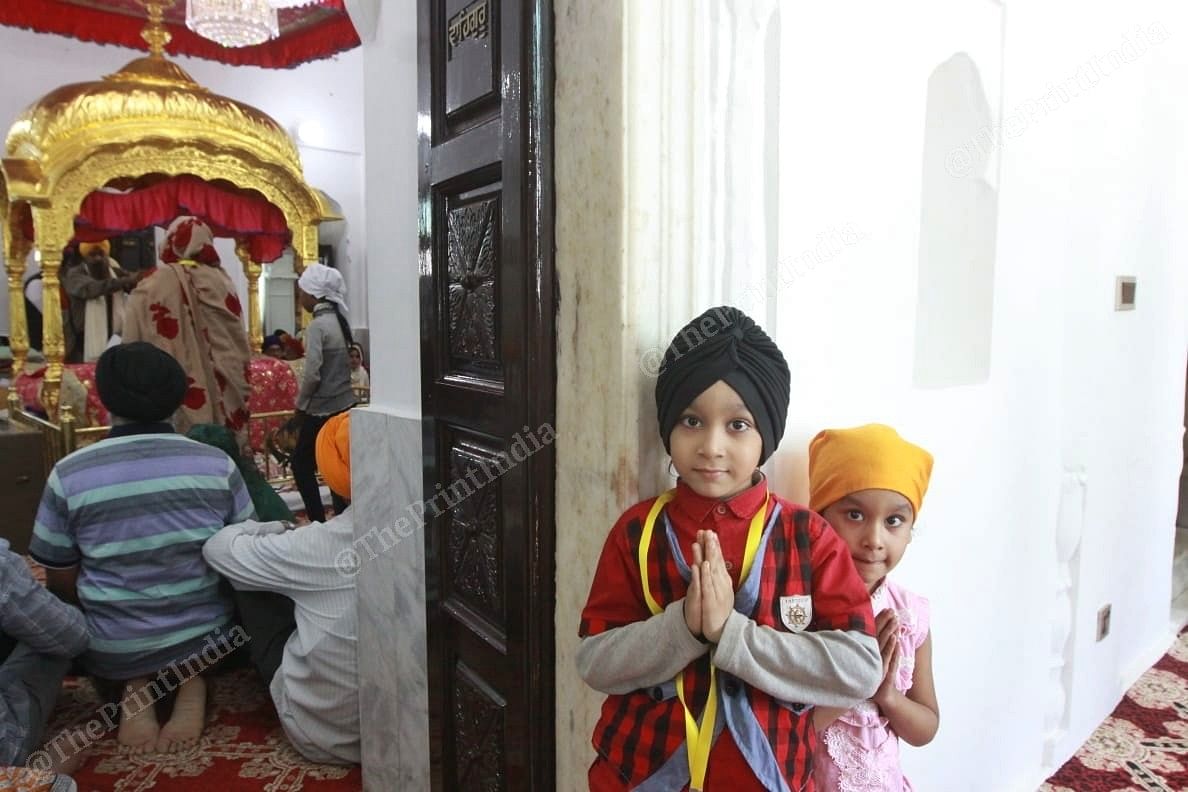 Sikh children praying at the newly inaugurated Kartarpur Corridor | Photo: Praveen Jain | ThePrint