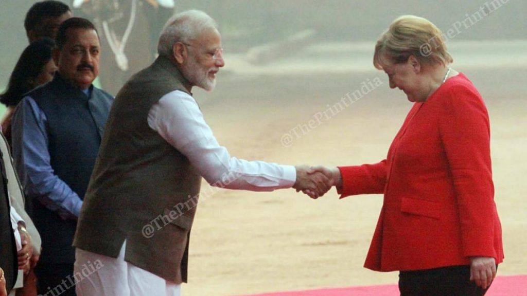 Prime Minister Narendra Modi greets German Chancellor Angela Merkel, on her visit to New Delhi, India | Photo: Praveen Jain | ThePrint