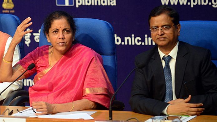 Union Finance Minister Nirmala Sitharaman (L) and former finance secretary of India Subhash Chandra Garg (R)