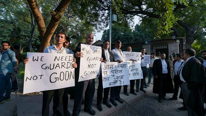 Lawyers protest against the police outside the Delhi High Court in New Delhi