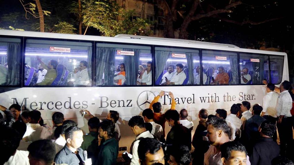 NCP MLAs leave in a bus after a meeting with party MLA's in Mumbai on 23 November