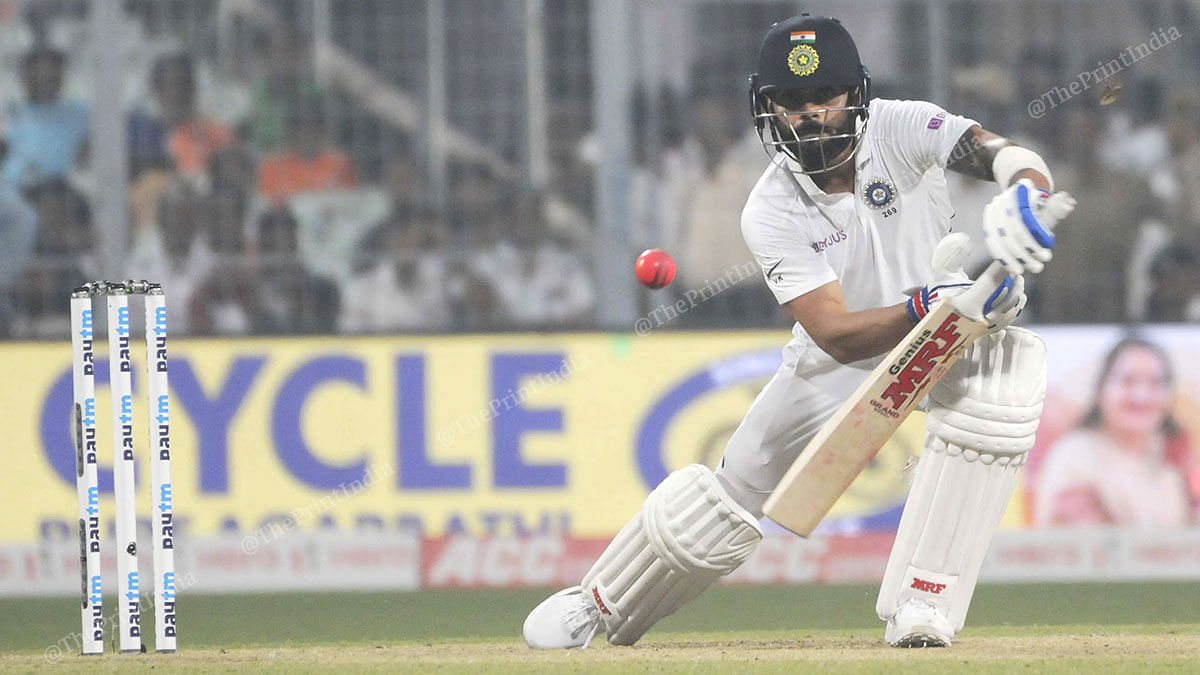Batsman Virat Kohli tackles the pink ball under the lights at Eden Garden. The Indian captain remained unbeaten on 59 at the end of the first day's play. | Photo: Ashok Nath Dey | ThePrint