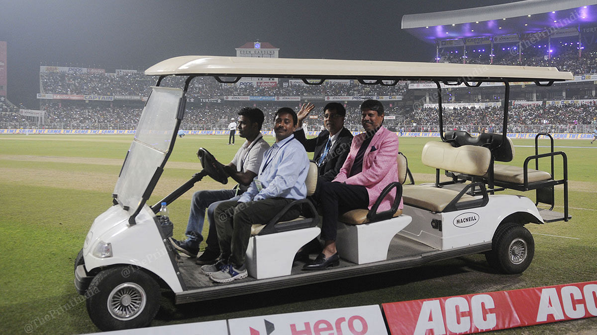 Kapil Dev sported a special pink jacket for the occasion. He is seen here with Krishnamachari Srikkanth taking a lap of Eden Gardens on a cart. | Photo: Ashok Nath Dey | ThePrint