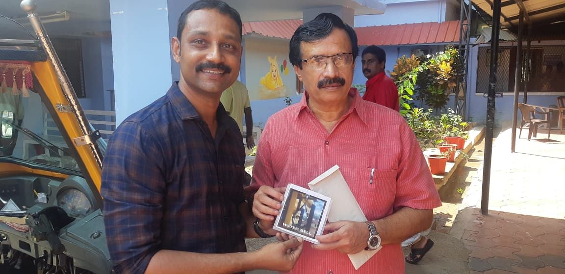 Jenil John with Kerala Education Minister C. Raveendranath | By special arrangement