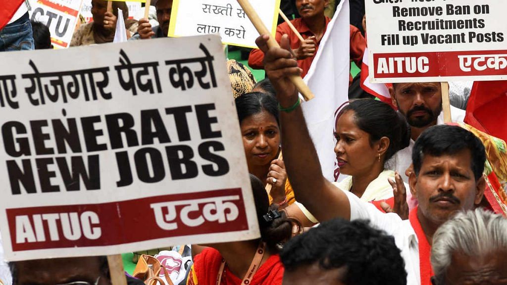 Workers and activists from all Trade Unions attend a protest rally against the government in New Delhi on 30 September