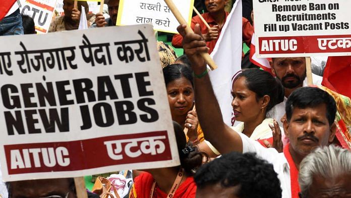 Workers and activists from all Trade Unions attend a protest rally against the government in New Delhi on 30 September