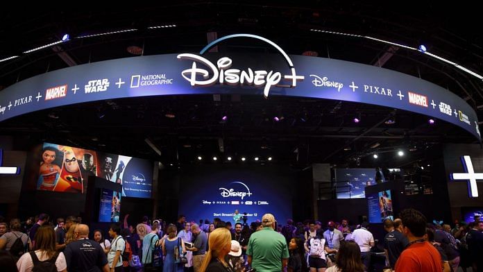 Attendees sign up for the Disney+ streaming service during the D23 Expo 2019 in Anaheim, California | Photographer: Patrick T. Fallon | Bloomberg