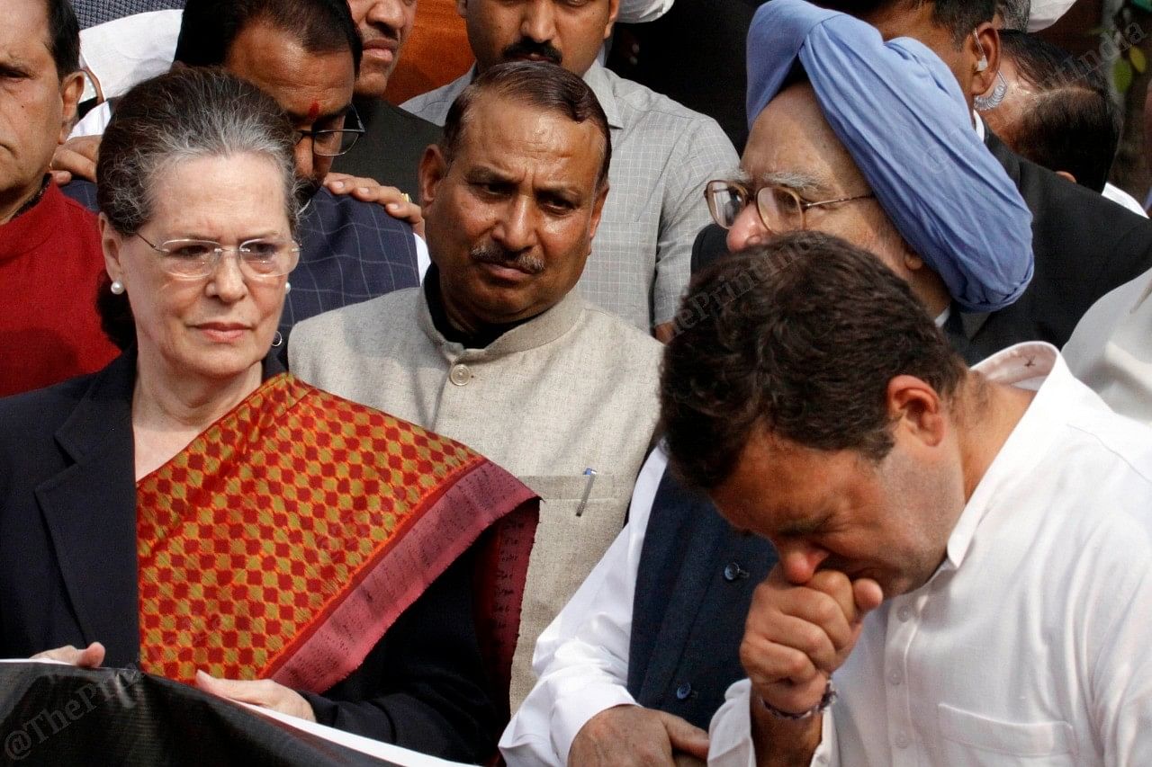 (L-R) Congress leaders Sonia Gandhi, Manmohan Singh, and Rahul Gandhi at the protest. Parliament had to be adjourned Monday after the opposition protested against the government formation in Maharashtra. | Photo: Praveen Jain | ThePrint 