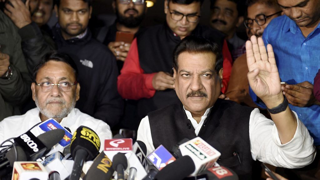 Nationalist Congress Party (NCP) leader Nawab Malik (L) along with Congress leader Prithviraj Chavan addresses a press conference on Maharashtra government formation, in New Delhi. | PTI
