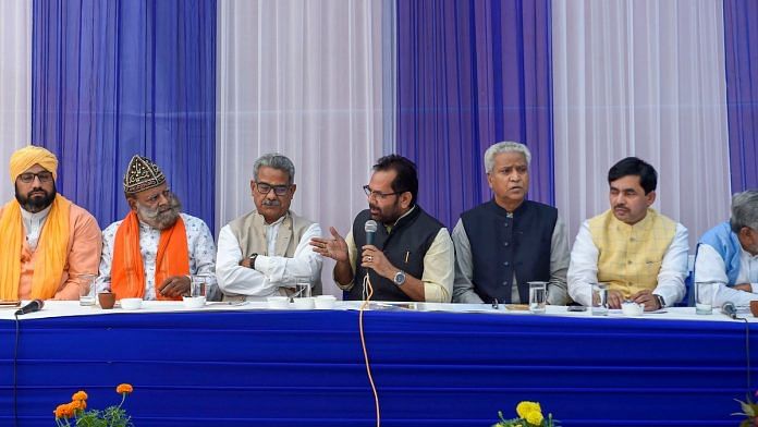 Union Minority Affairs Minister Mukhtar Abbas Naqvi speaks as RSS leader Ramlal and others look on during a meeting, at his residence in New Delhi. | PTI