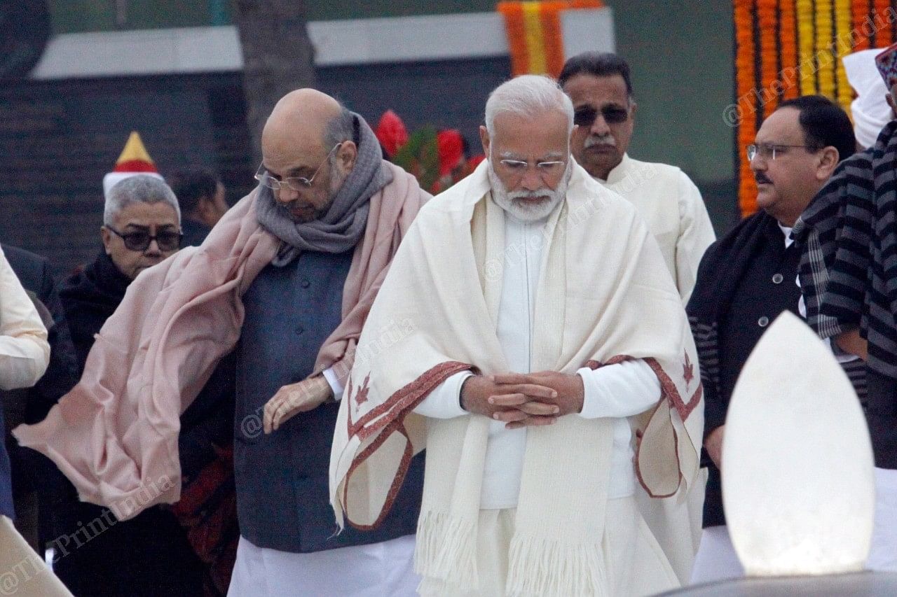 PM Modi and Amit Shah walk towards the memorial to pay their tributes | Photo: Praveen Jain | ThePrint