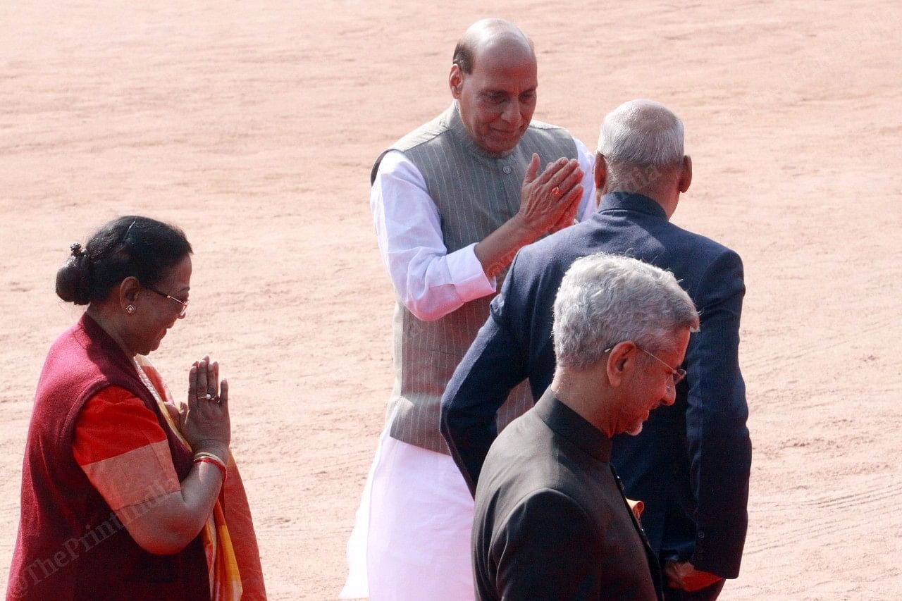 Rajnath Singh greets President Ram Nath Kovind and first lady Savita Kovind, while S. Jaishankar walks ahead