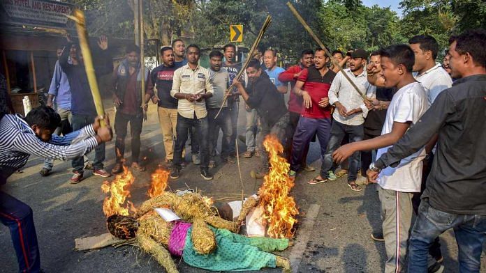 Demonstrators burn an effigy and raise slogans during protest against the Citizenship Amendment Bill at Boko in Assam's Kamrup