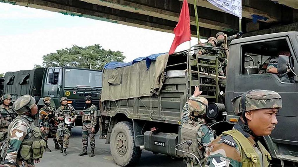 Army personnel prepare for a flag march following protests against the Citizenship (Amendment) Bill, at Bokel, in Dibrugarh on 11 December