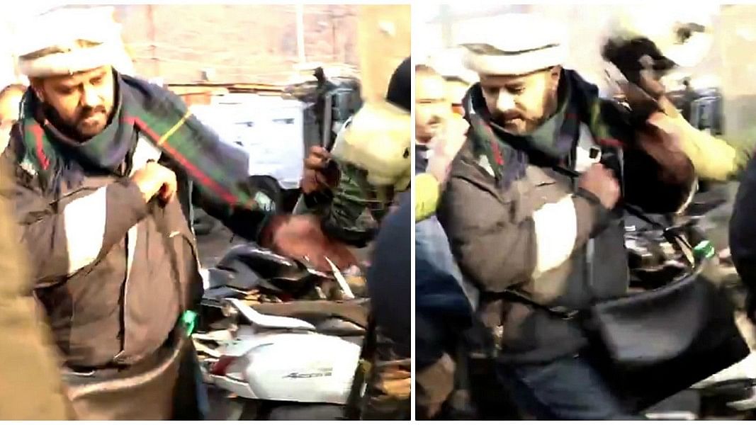 A screen grab from a video which shows ThePrint's special correspondent Azaan Javaid being assaulted by policemen in Srinagar.