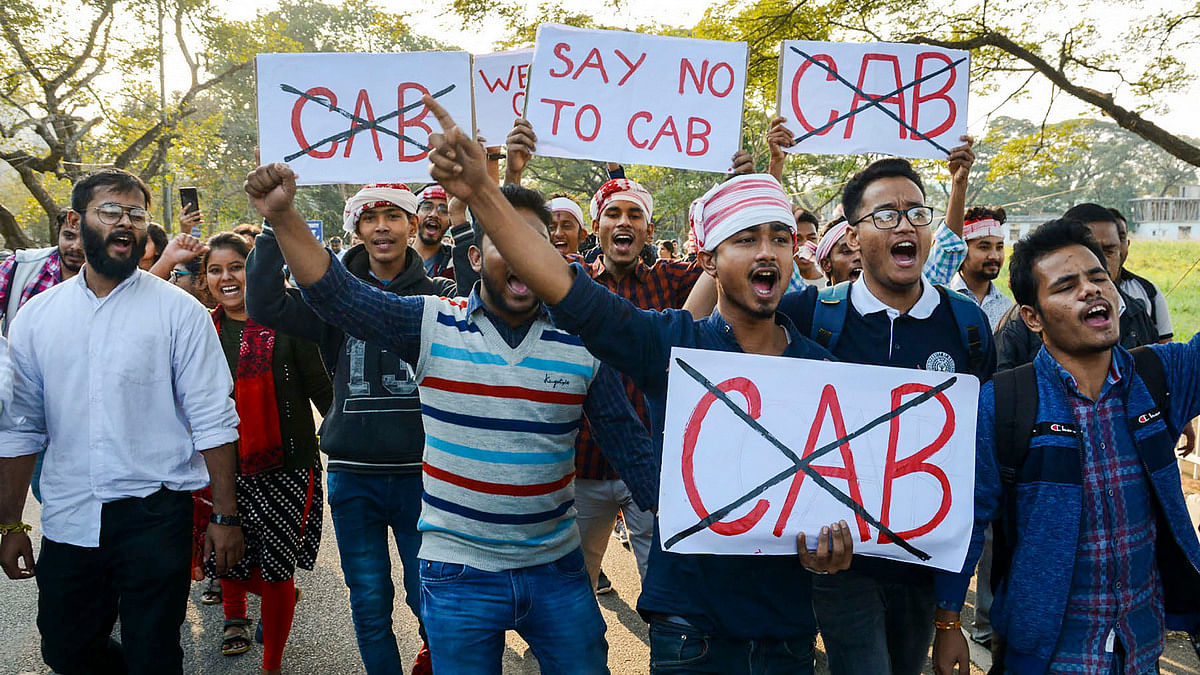 Gauhati University students raise slogans against Citizenship Amendment Bill (CAB), which was signed into act Friday morning, in Guwahati, on 9 December 2019 | PTI