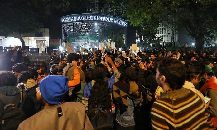 People protest outside the Delhi Police headquarters on Sunday night | ThePrint