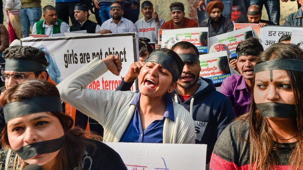 National Students' Union of India members raising slogans during a protest against the rape and brutal murder of a veterinarian in Hyderabad | PTI