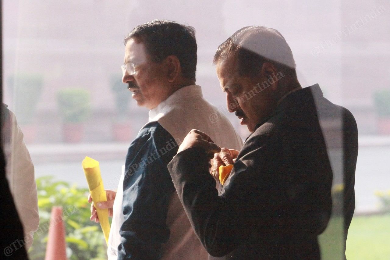 Union ministers Pralhad Venkatesh Joshi and Jitendra Singh wait for PM's arrival outside Parliament House Library
