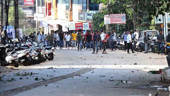 Picture released by Mangaluru Police showing protesters pelting stones
