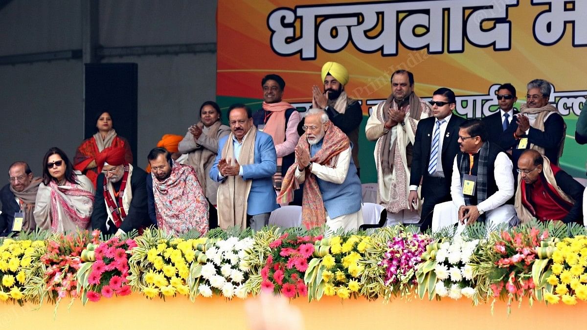 PM Narendra Modi with other BJP leaders at a rally in Ramlila Maidan in New Delhi on 22 December