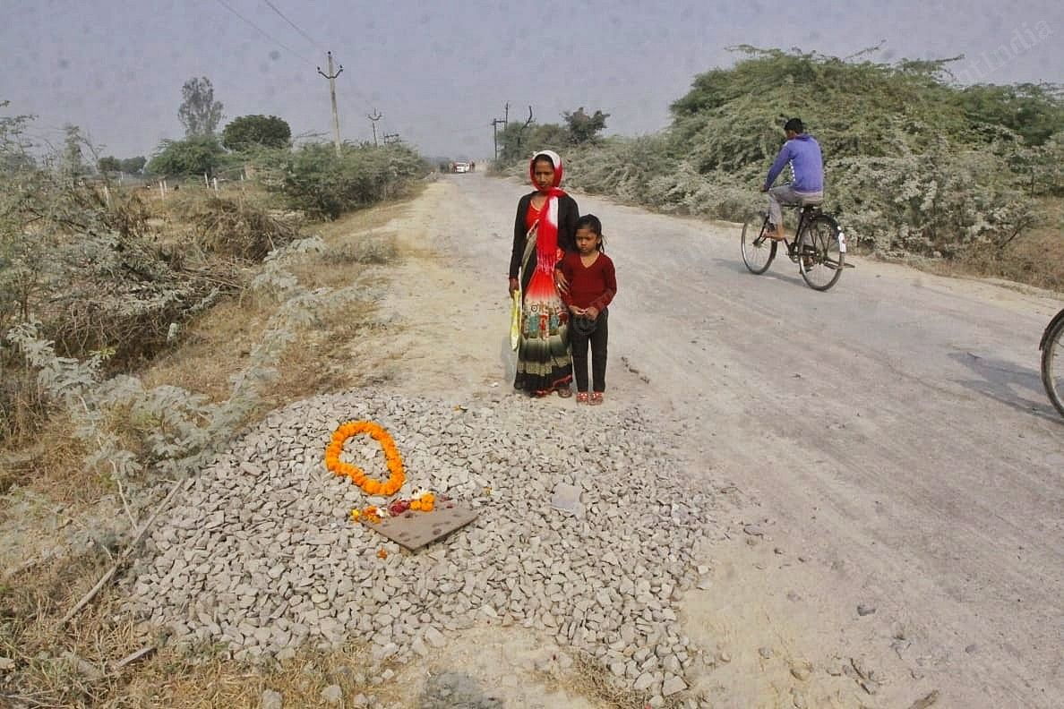 People pass by a makeshift memorial created at the spot where the 23-year-old was set on fire | Praveen Jain | ThePrint