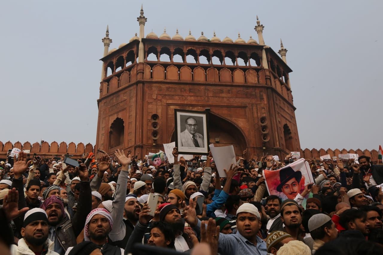 The crowd at Jama Masjid protesting against Citizenship Amendment Act, holding the photo of BR Ambedkar | Photo: Manisha Mondal | ThePrint