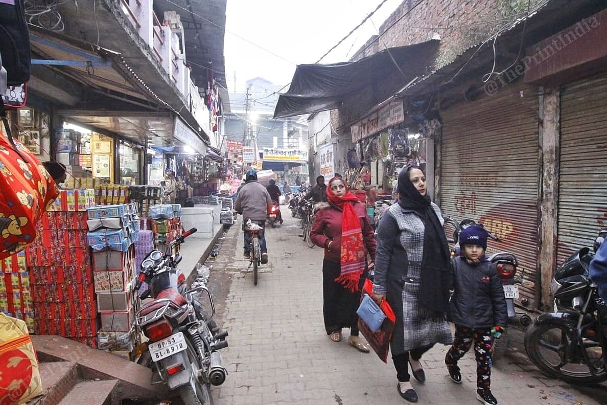 Shah Maruf market lane in Gorakhpur with people walking