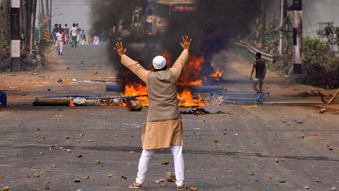 A protestor agitates against the passing of Citizenship Amendment Bill (CAB) at Sanmtragachi in Howrah district of West Bengal. | PTI