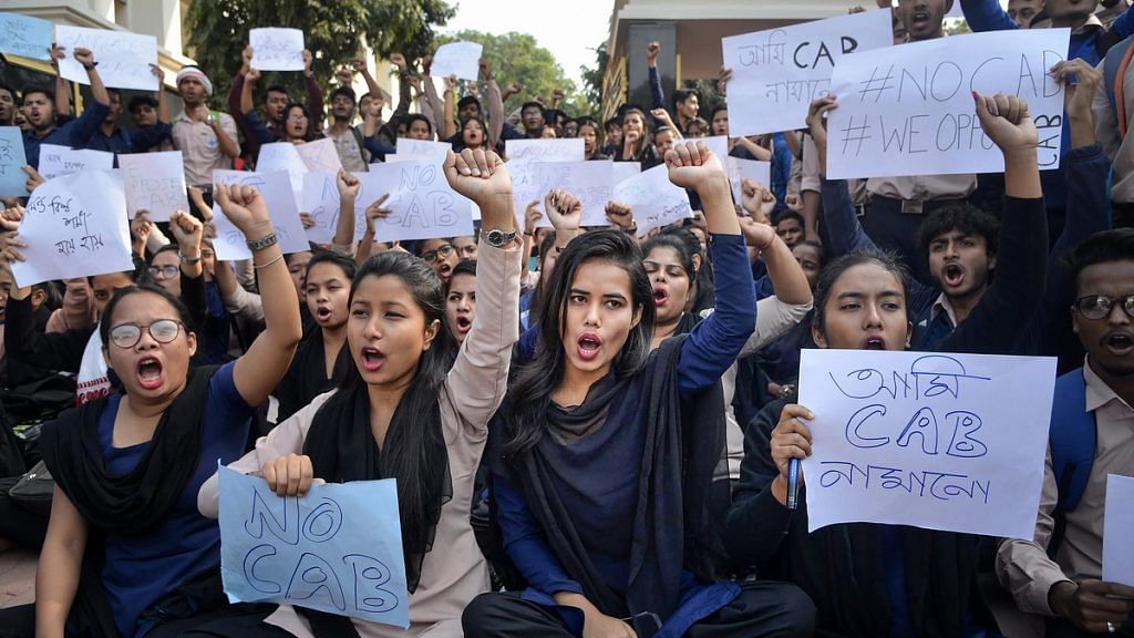 College students raise slogans in protest against the Citizenship Amendment Bill during a strike in Guwahati | PTI