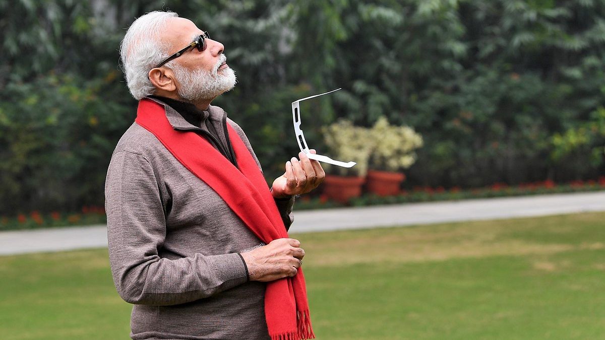 Modi tries to see the solar eclipse, becomes a meme — and Twitter is  'enjoying'