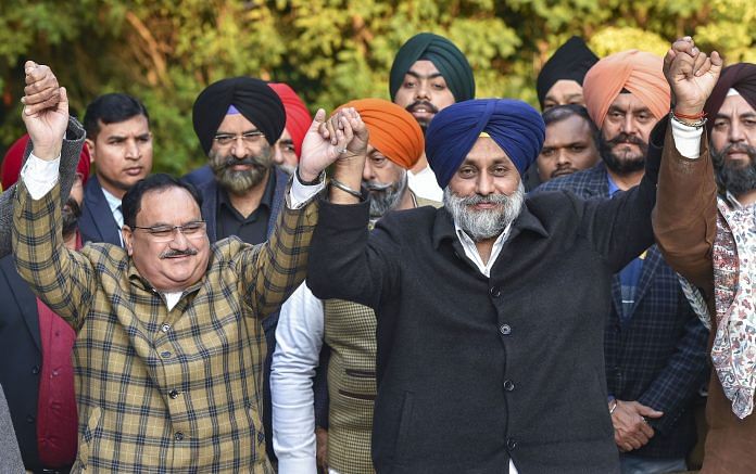 BJP National President Jagat Prakash Nadda (L) and Shiromani Akali Dal (SAD) chief Sukhbir Singh Badal join hands during a joint press conference regarding their parties alliance for the Delhi Assembly elections, in New Delhi. | PTI