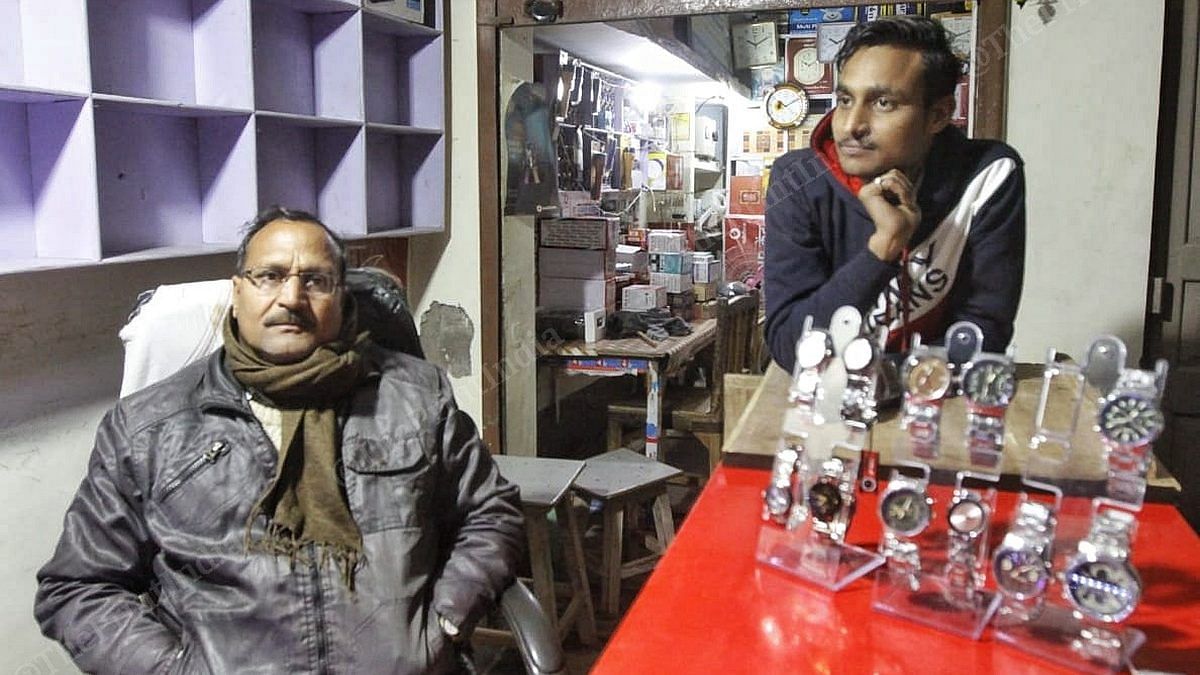Anil Bajpai (left) and his son Ravi at their watch store in Jagatpur, Rae Bareli | Photo: Praveen Jain | ThePrint