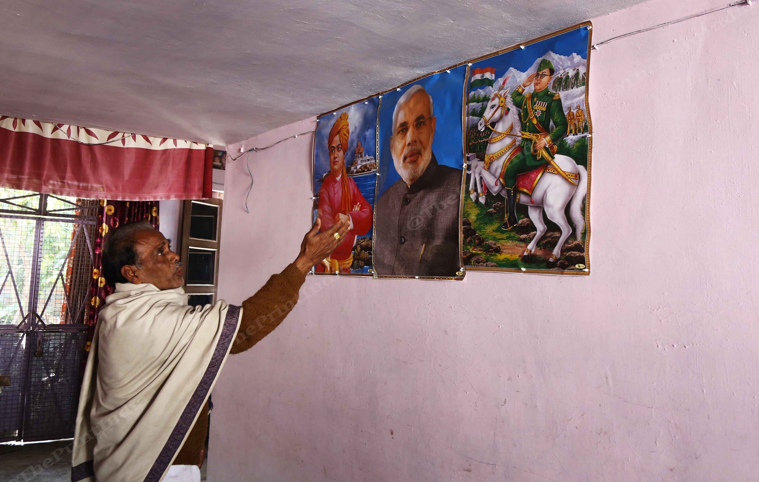 Ganesh Chandra Samudar has posters of Swami Vivekananda, PM Narendra Modi and Subhash Chandra Bose up on his walls | Photo: Manisha Mondal | ThePrint