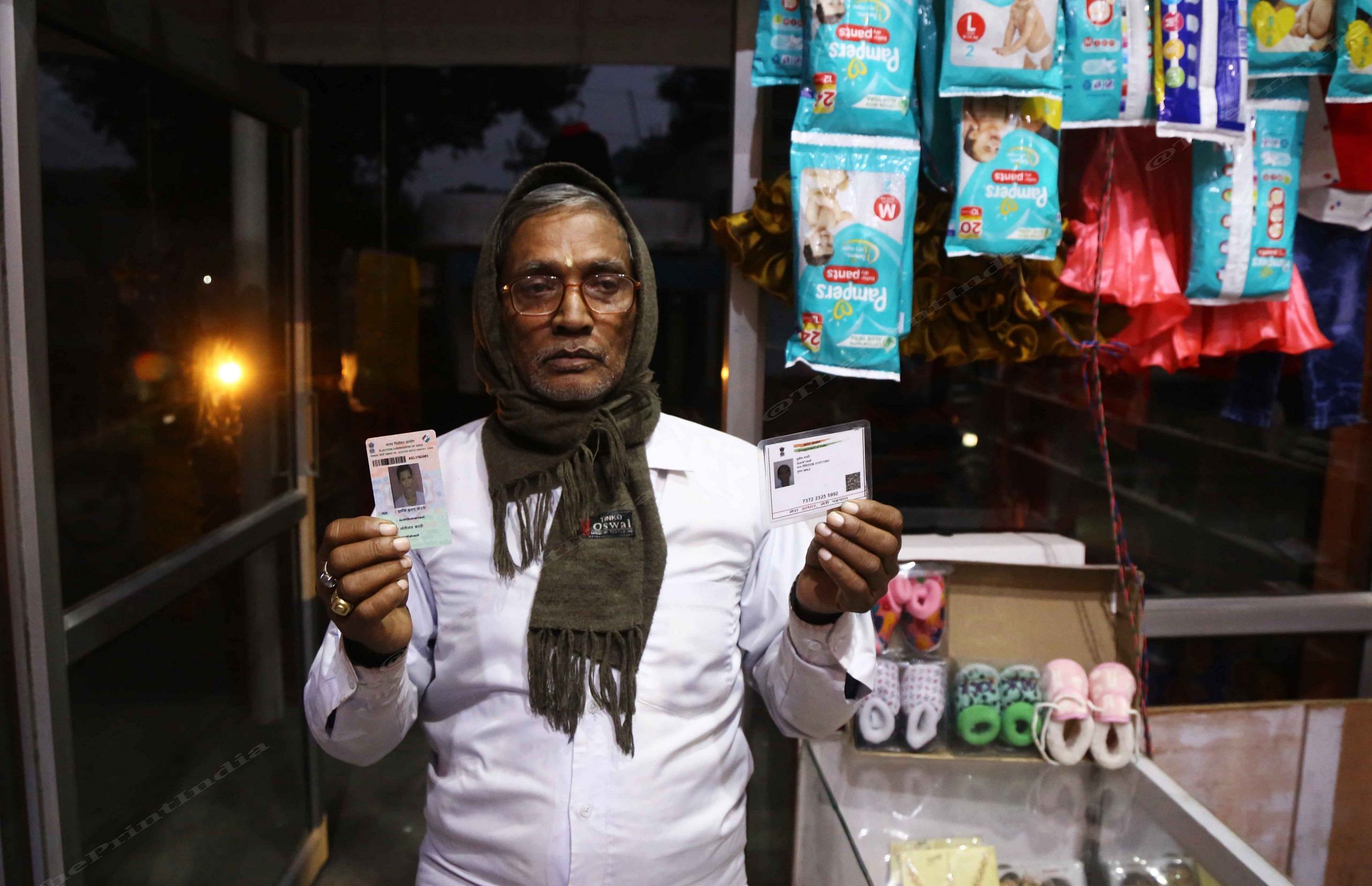 Sushil Baoli with his Aadhar card and voter ID | Photo: Manisha Mondal | ThePrint