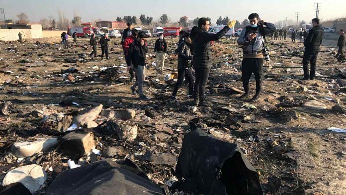 Debris from a plane belonging to Ukraine International Airlines which crashed on the outskirts of Tehran