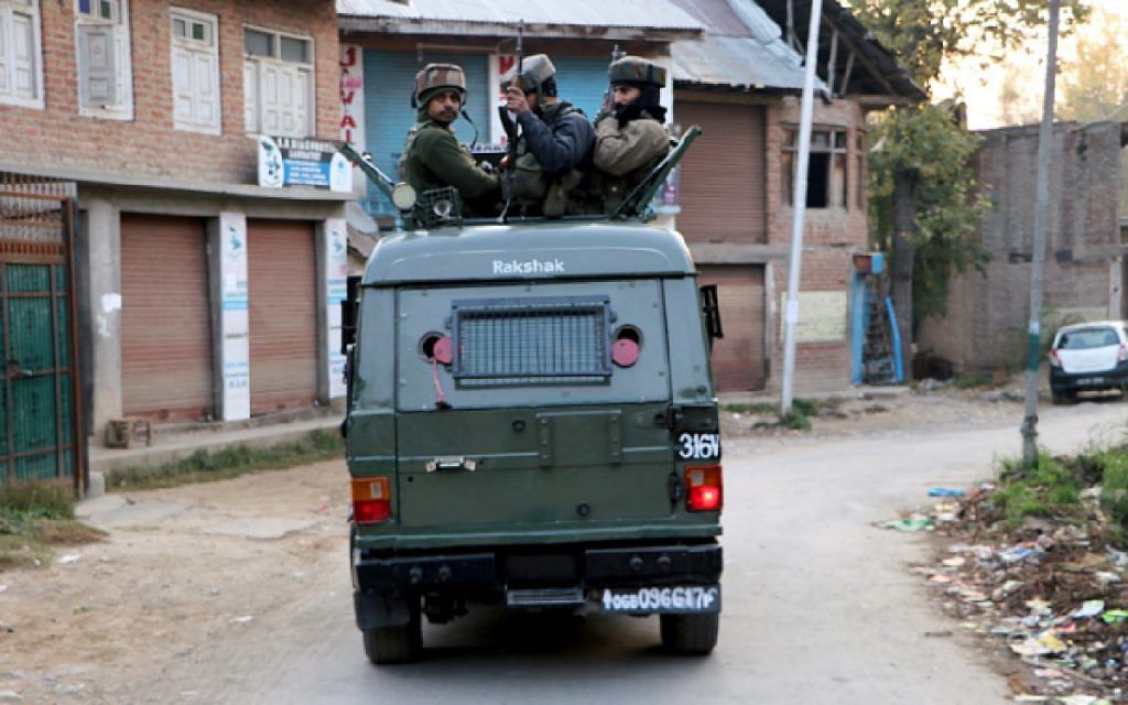Army soldiers patrol through Kulgam