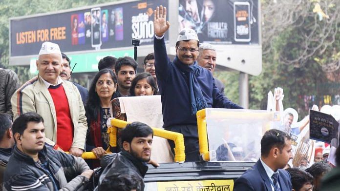 Delhi CM Arvind Kejriwal is seen at his roadshow Monday with wife Sunita and his children