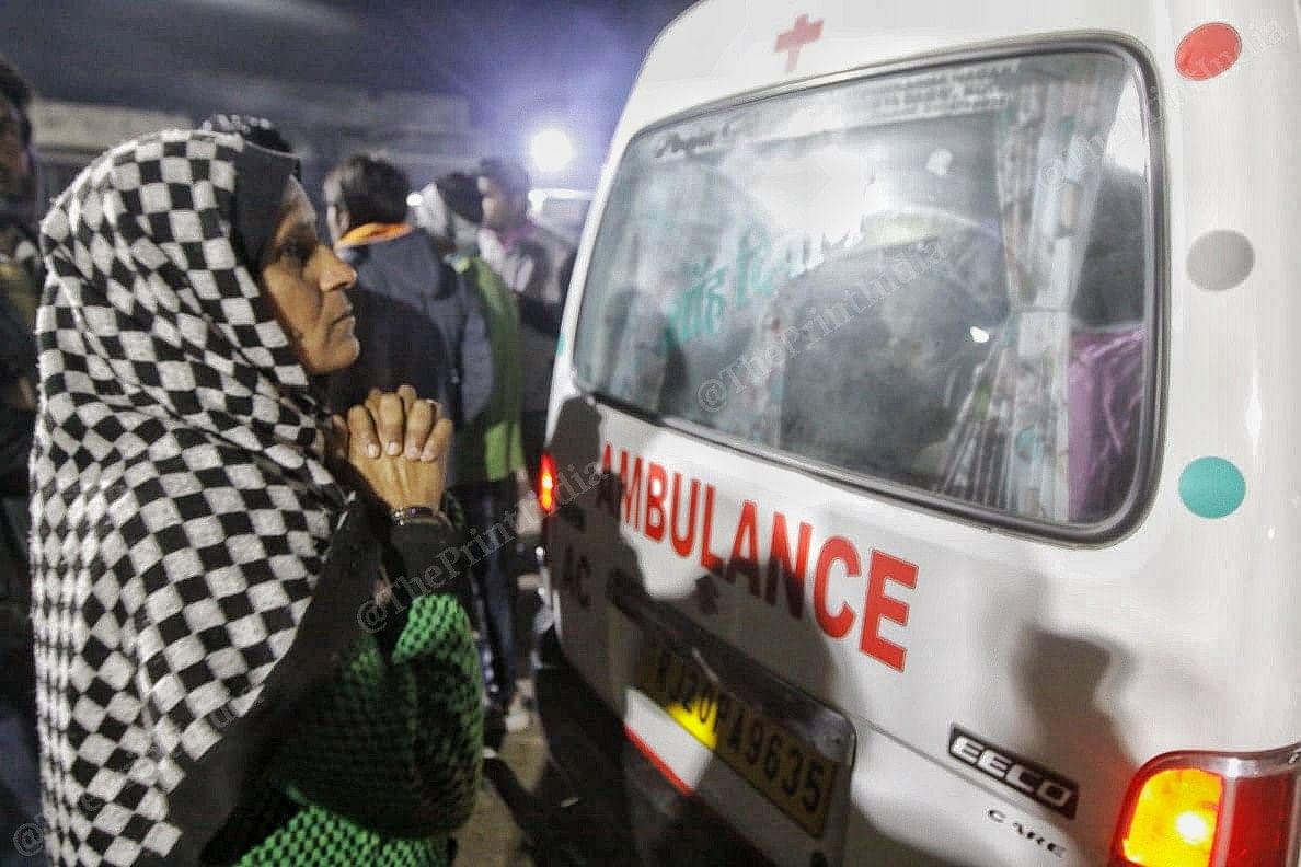 Family member of baby Asma prays for her recovery as she is transferred to a hospital in Jaipur from JK Lon Hospital | Photo: Praveen Jain | ThePrint