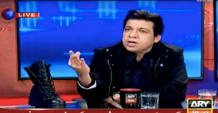 Faisal Vawda with the boot on ARY News show | YouTube screengrab