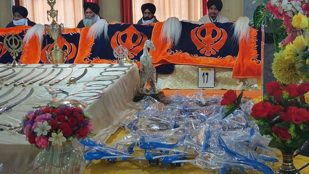 Devotees leave a toy plastic airplane within the gurudwara precincts at Baba Nihal Singhji Shaheed Gurudwara in Talhan